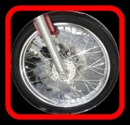 Detailed motorcycle wheel by Fifty Dollar Detail.